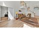Bright living room featuring hardwood floors and a staircase at 786 Oxford Dr, Davenport, FL 33897