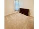 Simple bedroom featuring carpet flooring, a dresser, and a cozy atmosphere at 7871 Penrose Pl, Wildwood, FL 34785