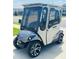 Street legal golf cart with custom wheels, lights, windshield and doors at 7871 Penrose Pl, Wildwood, FL 34785