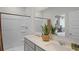 Bathroom featuring a double sink vanity with a framed mirror and a stand up shower at 801 Ambleside Dr, Haines City, FL 33844