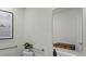 Bathroom with a decorative mirror, white vanity, and safety grab bars at 801 Ambleside Dr, Haines City, FL 33844