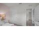 Bedroom showing the closet and entry doors in a light color scheme with a wood-look floor beyond at 801 Ambleside Dr, Haines City, FL 33844
