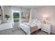 Beautiful Bedroom with view of pond and white tulle at 801 Ambleside Dr, Haines City, FL 33844
