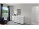 Modern bedroom featuring a dresser with decor at 801 Ambleside Dr, Haines City, FL 33844