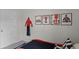 Fun, race car themed bedroom featuring a car bed, framed pictures, and tire accents at 801 Ambleside Dr, Haines City, FL 33844