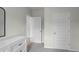 Hallway showcasing bedroom doors, hallway door and dresser at 801 Ambleside Dr, Haines City, FL 33844