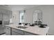 Kitchen island with seating, stainless steel sink, and views of the backyard at 801 Ambleside Dr, Haines City, FL 33844