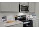 Well-equipped kitchen featuring stainless steel appliances and ample counter space at 801 Ambleside Dr, Haines City, FL 33844