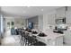 Open-concept kitchen and living area with ample seating and modern appliances at 801 Ambleside Dr, Haines City, FL 33844