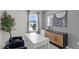 Bright office space with a large window, modern furniture, and decorative art at 801 Ambleside Dr, Haines City, FL 33844