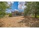 Large grassy backyard with mature trees and a screened in pool at 807 Ayden Oak Ln, Ocoee, FL 34761