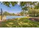 Community basketball court with nearby pool, clubhouse, and seating areas for Gathering enjoyment at 807 Ayden Oak Ln, Ocoee, FL 34761