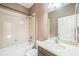 Bathroom with a combination tub and shower, a vanity, and neutral-colored walls at 807 Ayden Oak Ln, Ocoee, FL 34761