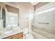 Bathroom includes shower and tub combination, vanity, and a window for natural light at 807 Ayden Oak Ln, Ocoee, FL 34761
