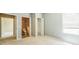 Bedroom features ensuite bathroom and closet, neutral paint, and large window at 807 Ayden Oak Ln, Ocoee, FL 34761