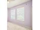 Bedroom with light purple walls, carpet, two windows and ceiling fan at 807 Ayden Oak Ln, Ocoee, FL 34761