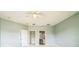 Spacious bedroom features neutral paint, ceiling fan and entry to bathroom and closet at 807 Ayden Oak Ln, Ocoee, FL 34761