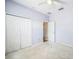 Bedroom with light purple walls, carpet, white closet doors and ceiling fan at 807 Ayden Oak Ln, Ocoee, FL 34761