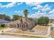 Single-story home on corner lot with palm trees, brick driveway, and well-maintained lawn at 807 Ayden Oak Ln, Ocoee, FL 34761