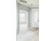 Bright foyer featuring an arched doorway, modern light fixture and decorative glass front door at 807 Ayden Oak Ln, Ocoee, FL 34761
