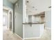 Open kitchen features a breakfast bar with granite countertops and neutral paint at 807 Ayden Oak Ln, Ocoee, FL 34761