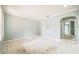 Large living room with light grey walls, white trim, and an arched doorway at 807 Ayden Oak Ln, Ocoee, FL 34761