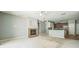 Comfortable living room features a fireplace, ceiling fan, neutral paint, and flows into the kitchen at 807 Ayden Oak Ln, Ocoee, FL 34761