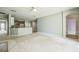 Inviting living room featuring a fireplace, ceiling fan, and seamless transition to the kitchen at 807 Ayden Oak Ln, Ocoee, FL 34761