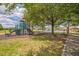 Well-maintained community playground with slides and climbing structure, near the pool and basketball court at 807 Ayden Oak Ln, Ocoee, FL 34761