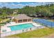 Community pool and clubhouse with lounge chairs and basketball court for outdoor enjoyment at 807 Ayden Oak Ln, Ocoee, FL 34761
