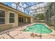 Screened pool with brick pool deck and view of the back of house at 807 Ayden Oak Ln, Ocoee, FL 34761