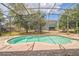 Screened pool with brick pool deck and view of the backyard at 807 Ayden Oak Ln, Ocoee, FL 34761