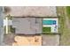 Aerial top-down view of a property with a pool, spa, and outdoor living space at 8105 Fenton St, Orlando, FL 32836