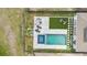 Overhead shot of backyard retreat with a pool, spa, fire pit, lounge chairs and stylish patio at 8105 Fenton St, Orlando, FL 32836