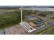 Aerial view of the home showcasing the backyard pool and proximity to a nearby lake at 8105 Fenton St, Orlando, FL 32836