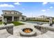 Stunning backyard with a modern pool and spa, outdoor seating, and a cozy fire pit, ideal for entertaining guests at 8105 Fenton St, Orlando, FL 32836