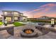 Stunning backyard with a modern pool and spa, outdoor seating, and a cozy fire pit, ideal for entertaining guests at 8105 Fenton St, Orlando, FL 32836