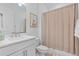 Stylish bathroom featuring a vanity, mirror, and shower with a curtain at 8105 Fenton St, Orlando, FL 32836