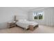 Bright bedroom with white walls, carpet flooring, and a king-size bed with a bench at 8105 Fenton St, Orlando, FL 32836