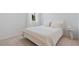 Clean-looking bedroom with bright white walls, carpet flooring, and a bed at 8105 Fenton St, Orlando, FL 32836