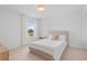 Bright bedroom with white walls, carpet flooring, and a queen-size bed at 8105 Fenton St, Orlando, FL 32836