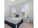 Cozy bedroom with bright white walls, carpet flooring, and a queen-size bed at 8105 Fenton St, Orlando, FL 32836