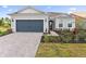Beautiful single-story home featuring a two-car garage, well-manicured lawn, and a welcoming entryway at 8105 Fenton St, Orlando, FL 32836
