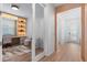 Bright hallway leading to a home office with a built-in desk and shelving at 8105 Fenton St, Orlando, FL 32836