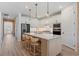 This well-appointed kitchen boasts a large island with seating, stainless appliances, and ample cabinet space at 8105 Fenton St, Orlando, FL 32836