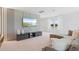 Comfortable living room featuring modern decor, a large screen television, and neutral tones throughout at 8105 Fenton St, Orlando, FL 32836