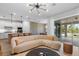 Bright living room features a modern sofa, stylish lighting, and sliding doors leading to an outdoor patio at 8105 Fenton St, Orlando, FL 32836
