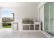 Covered patio features a built-in outdoor kitchen with stainless steel appliances, perfect for outdoor entertaining at 8105 Fenton St, Orlando, FL 32836