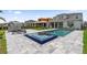 Beautiful pool and spa with sleek lounge chairs and well-manicured green lawn, perfect for outdoor relaxation and entertainment at 8105 Fenton St, Orlando, FL 32836