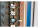 Close-up shot of wine bottles displayed on sleek metal racks with mood lighting at 8105 Fenton St, Orlando, FL 32836